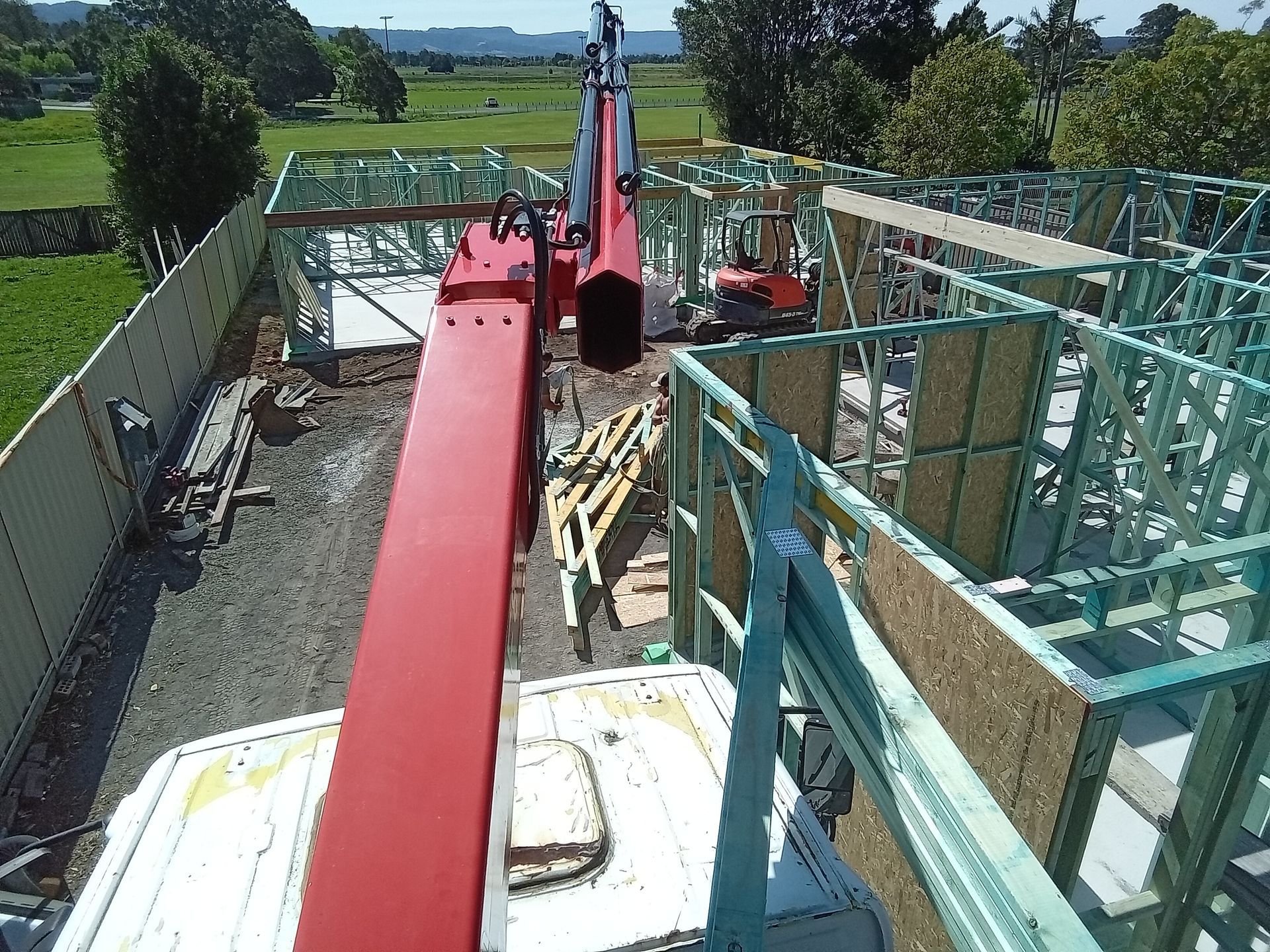 Prefabricated timber wall frames crane-lifted into position for a residential construction project in Nowra, South Coast NSW.