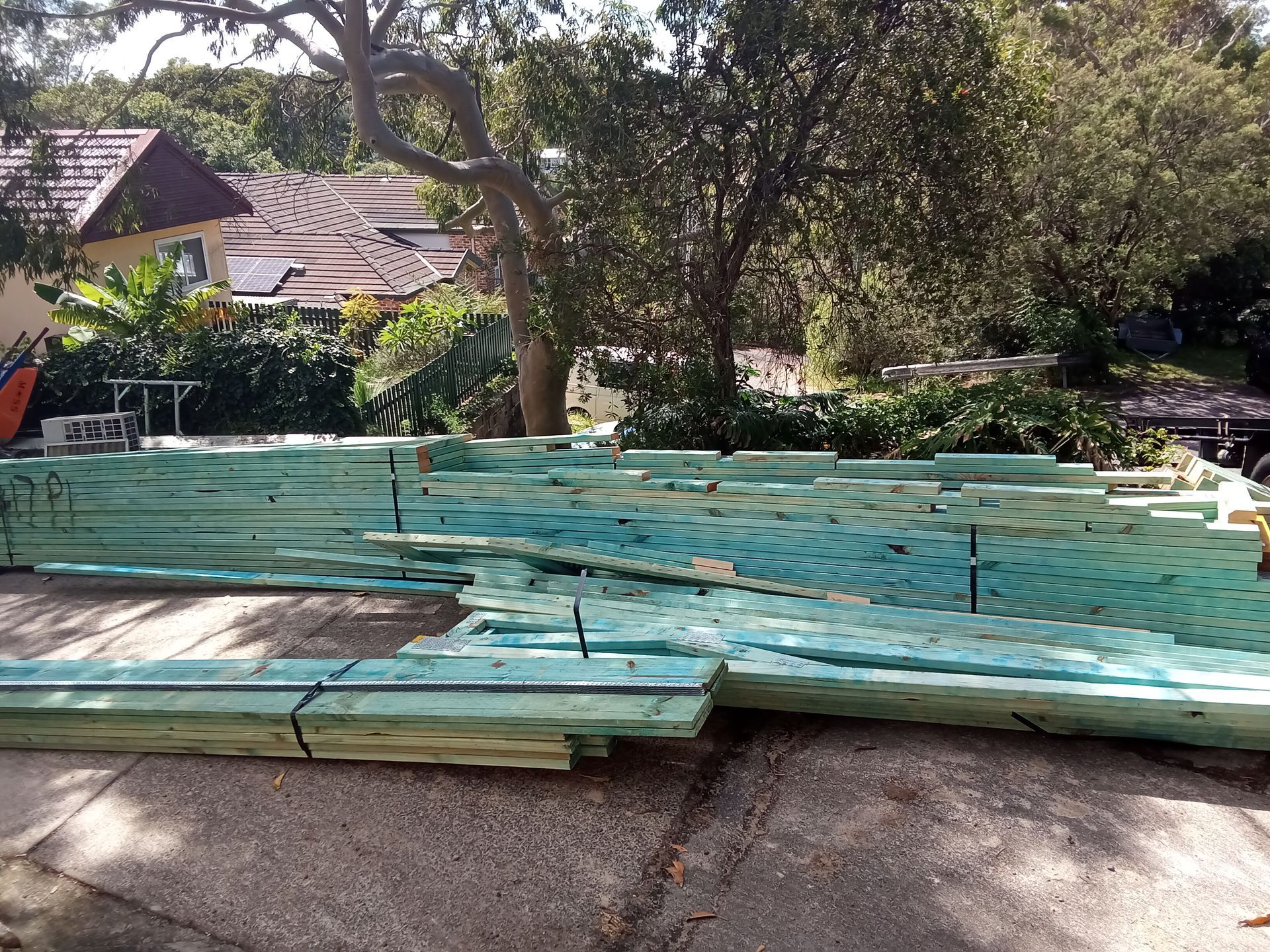 Timber roof trusses delivered to a residential construction site in Jannali, Sydney, ready for installation.