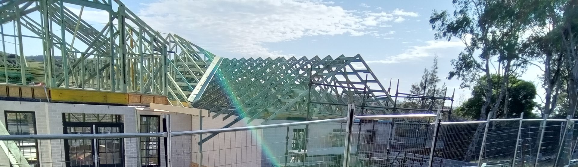 Engineered timber roof trusses installed on residential construction project