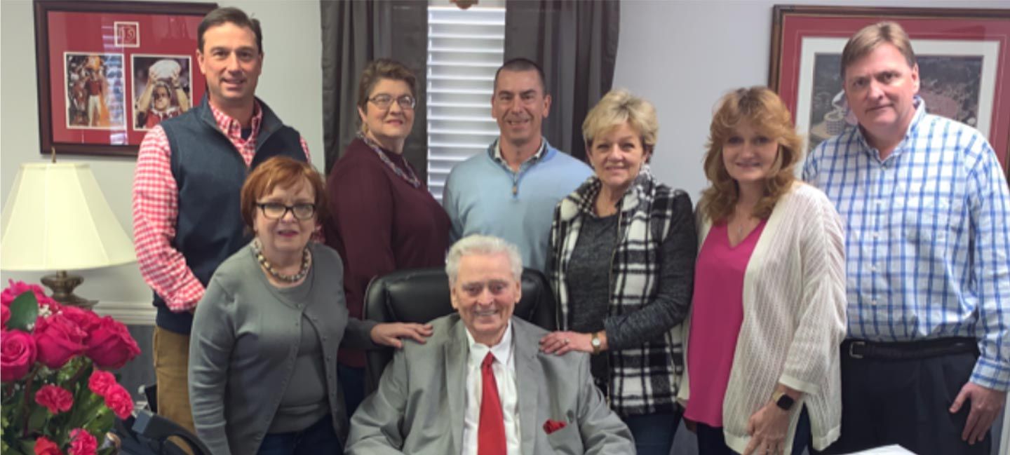 JL Lane Lending staff standing together and smiling