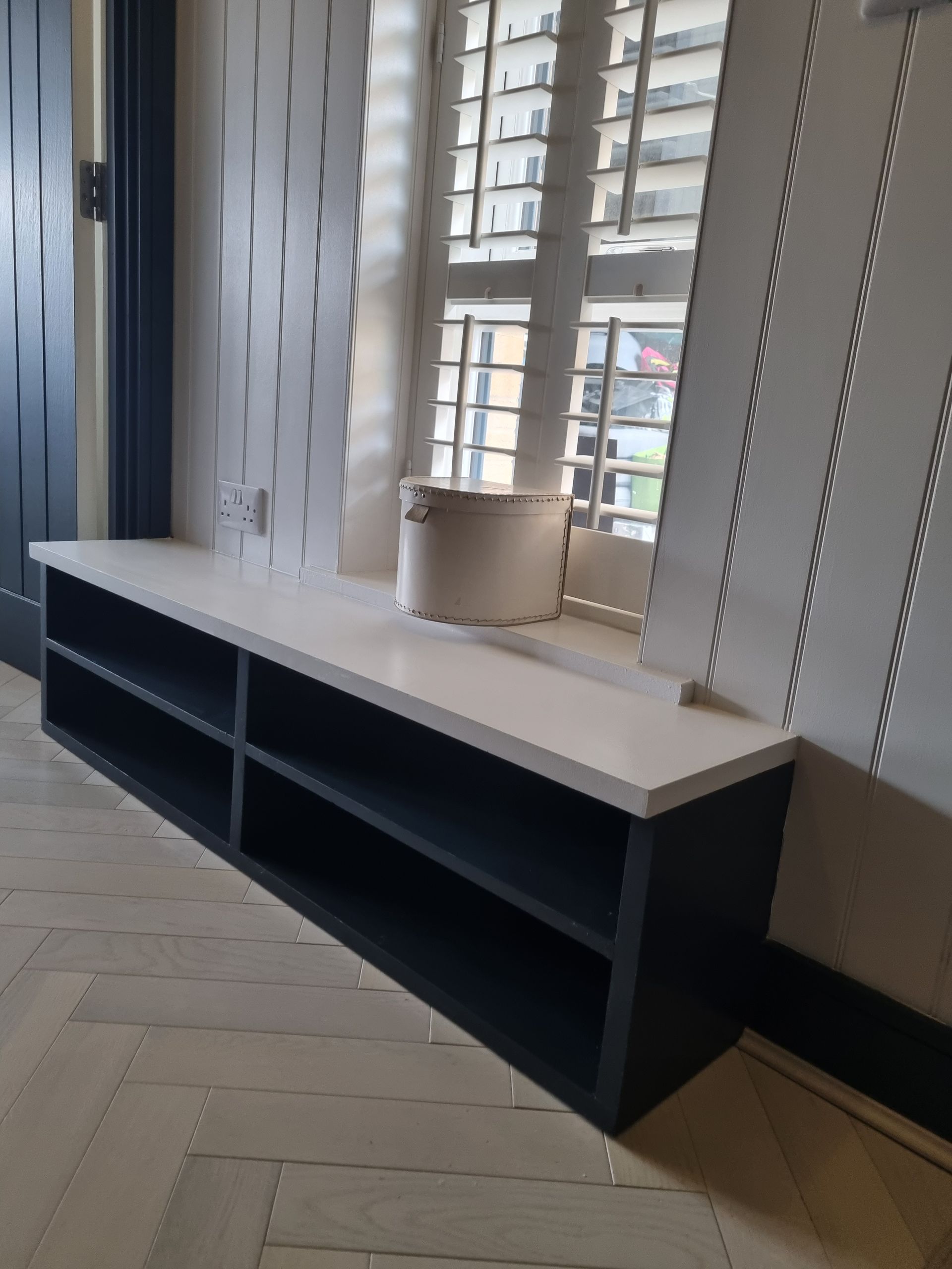 Bespoke shoe storage boot room and wall panelling with herringbone  flooring 