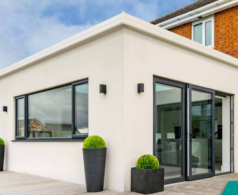 single storey house extension with render finish and flat roof