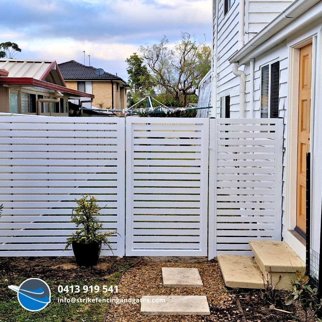 White Horizontal Slat Fence With Gate Next to a House — Strike Fencing & Gates In Erina, NSW
