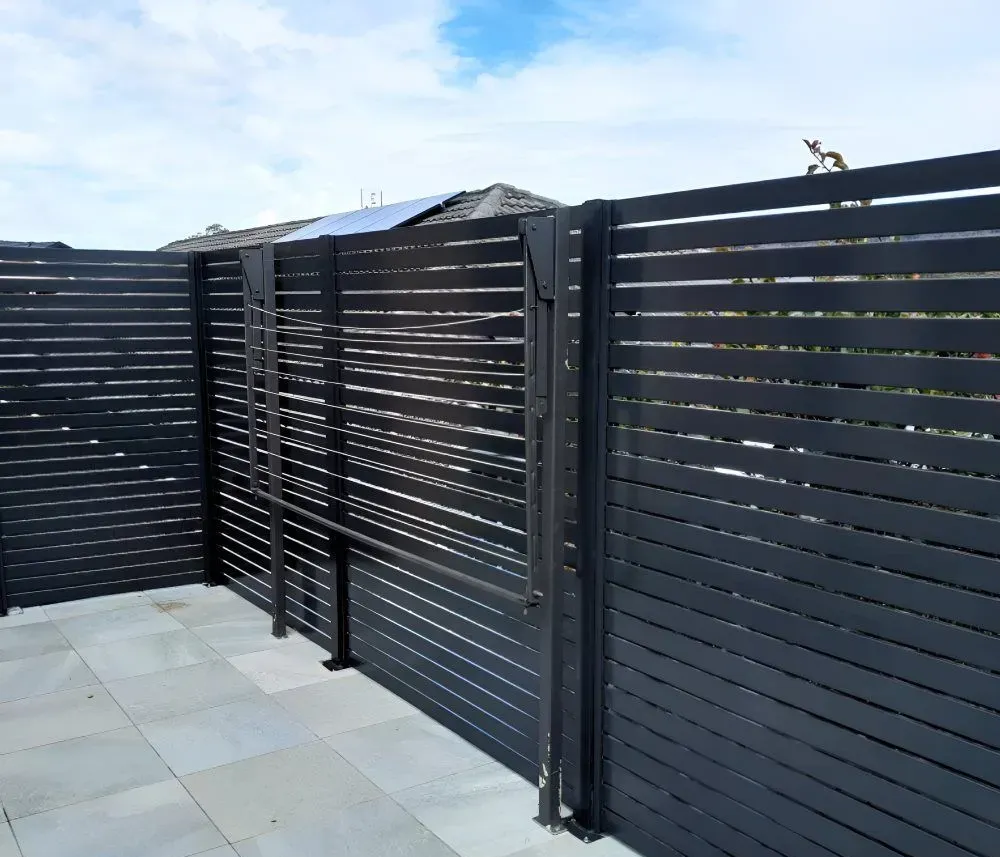 Black Horizontal Slat Fence With Gate — Strike Fencing & Gates In Wamberal, NSW
