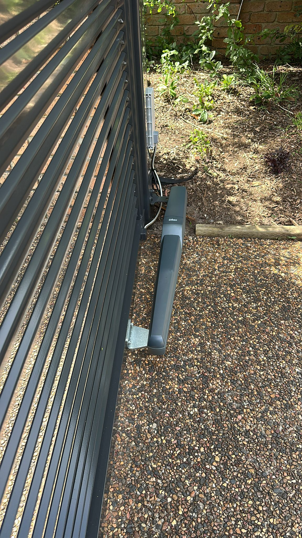 Metal Gate With an Automated Arm — Strike Fencing & Gates In Umina, NSW