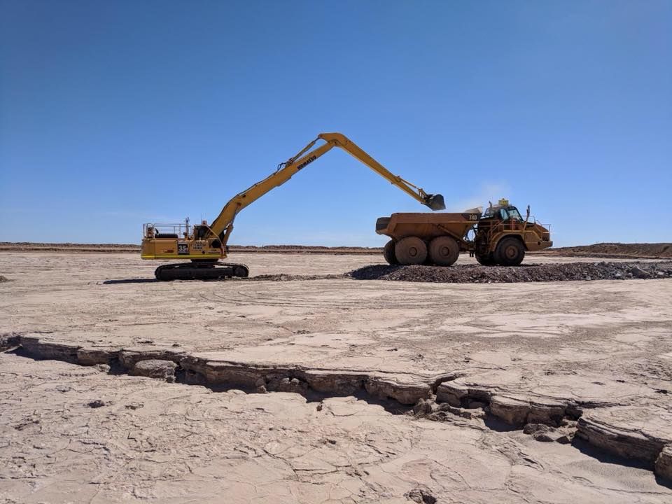 Long reach excavator filling an ADT