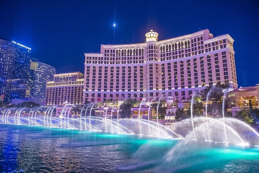 A large building with a fountain in front of it.