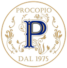 Logo Procopio in oro e blu, con monogramma floreale ornato e la scritta “DAL 1975” in un logo circolare