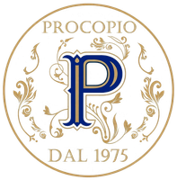 Logo Procopio in oro e blu, con monogramma floreale ornato e la scritta “DAL 1975” in un logo circolare