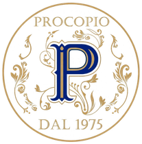 Logo Procopio in oro e blu, con monogramma floreale ornato e la scritta “DAL 1975” in un logo circolare