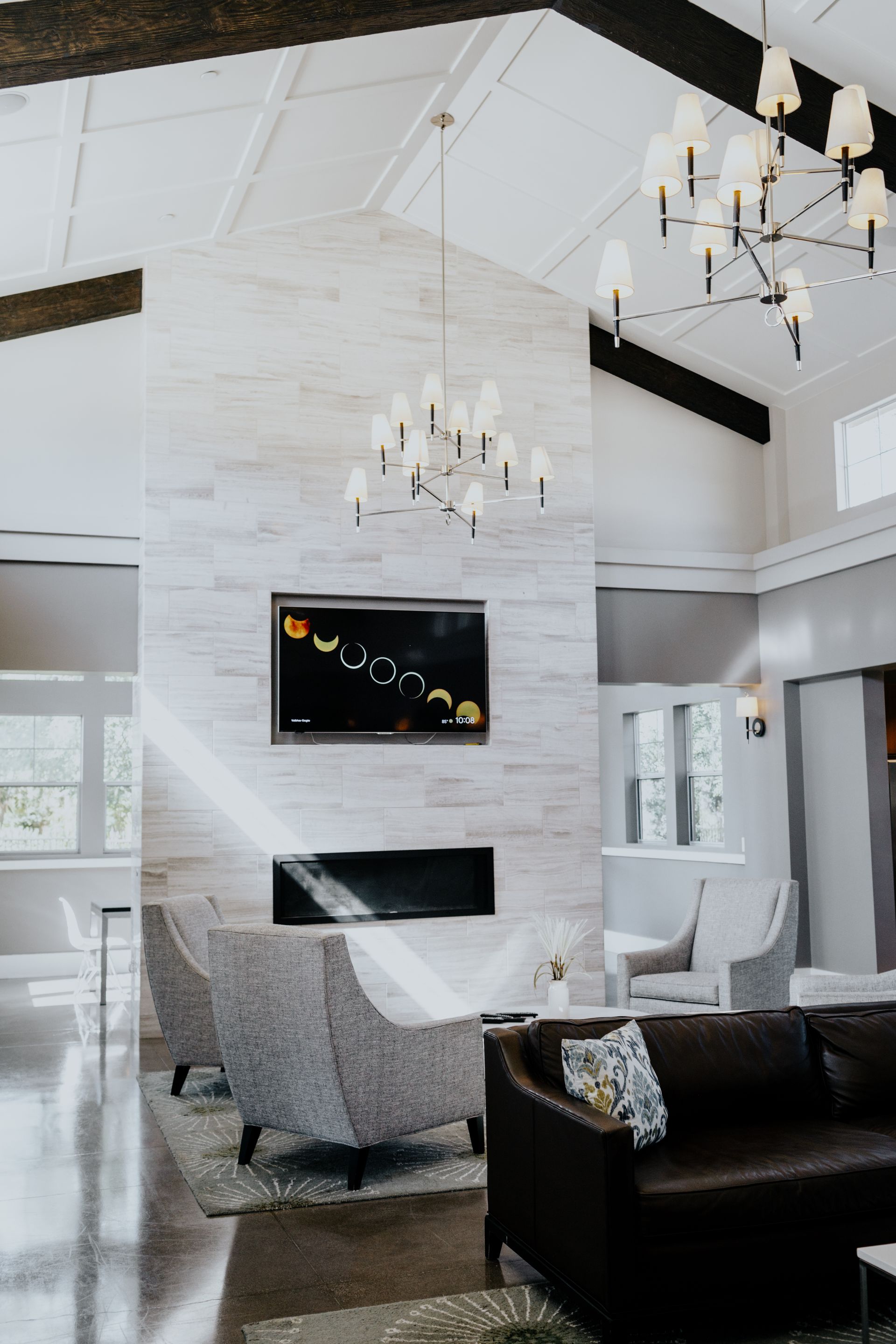 A living room filled with furniture and a television