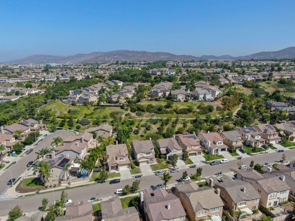 An aerial view of a residential area with lots of houses and trees