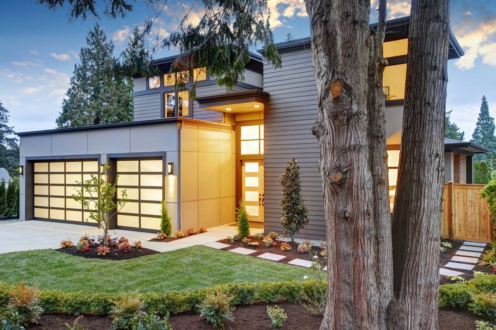 A modern house with a tree in front of it