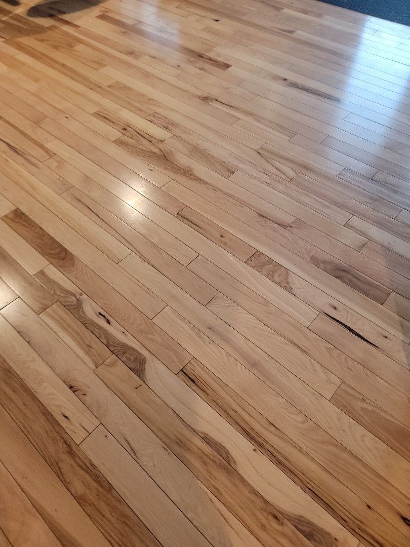 A close up of a wooden floor in a living room