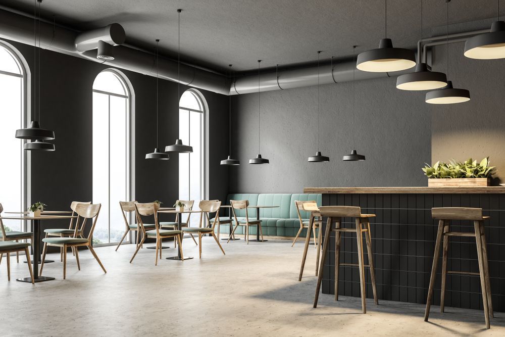 A restaurant with tables and chairs and a bar
