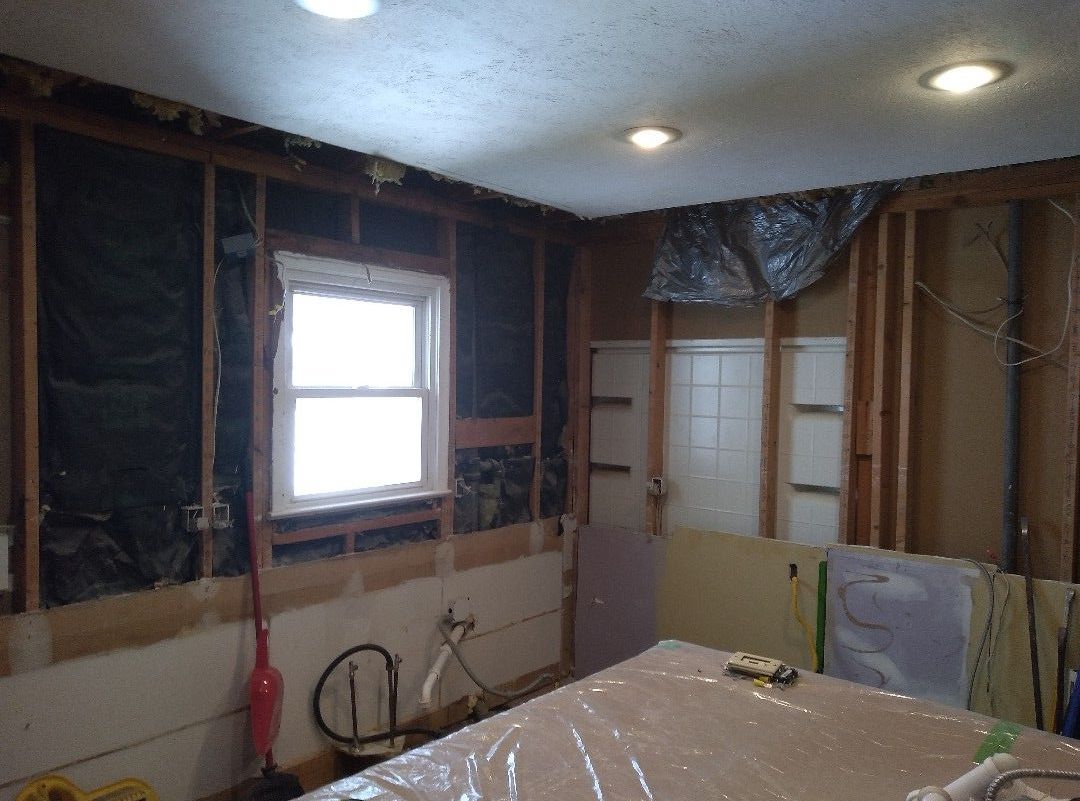 A room that is being remodeled with a window in the ceiling
