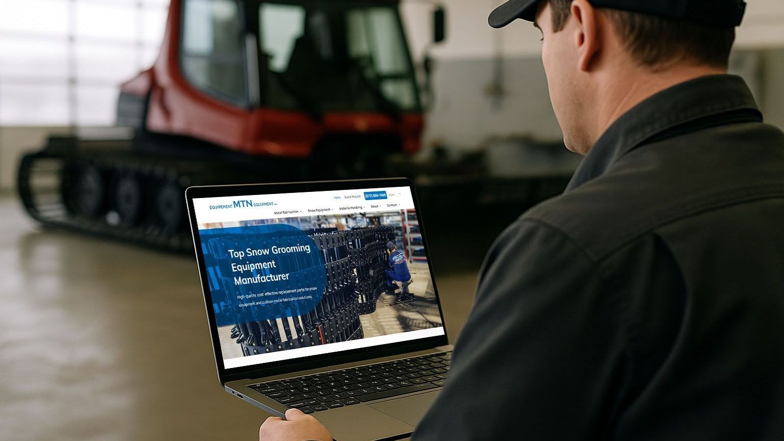 Person viewing the new MTN Equipment website on a laptop with a snow groomer in the background.