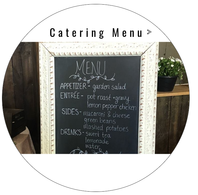 Catering menu chalkboard with appetizers, entrees, sides, and drinks on a rustic signboard