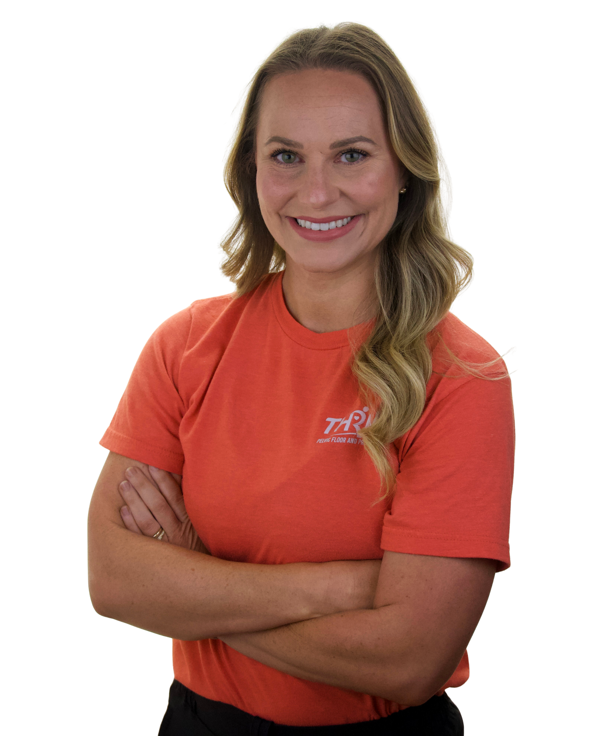 Smiling woman with crossed arms wearing an orange T-shirt on a white background