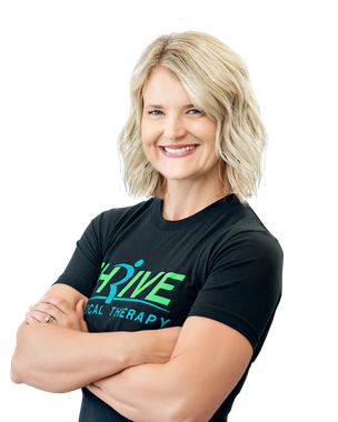 Smiling woman in a black DRiVE therapy T-shirt, standing with arms crossed on a white background