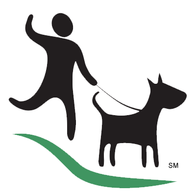 A man is walking a dog on a leash.