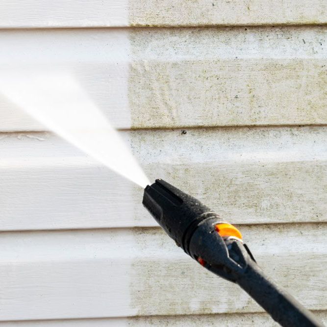 siding being power washed