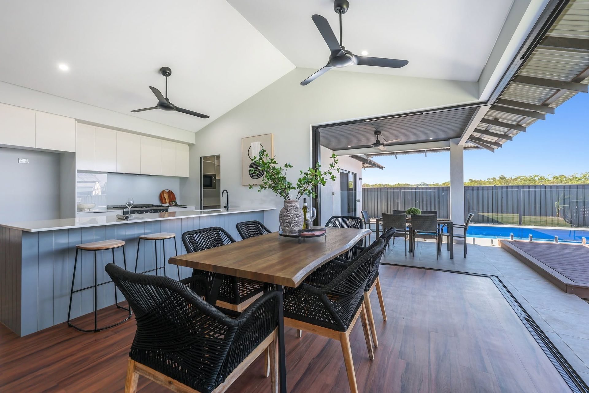 Covered Outdoor Dining Area With Wooden Table — Tick of Approval Pty Ltd in Berrimah, NT
