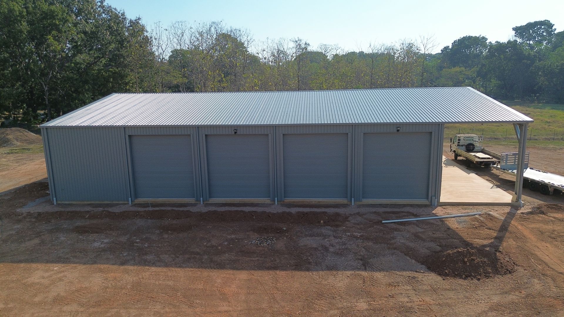 Long Metal-roofed Shed in a Dirt Lot — Tick of Approval Pty Ltd in Berrimah, NT