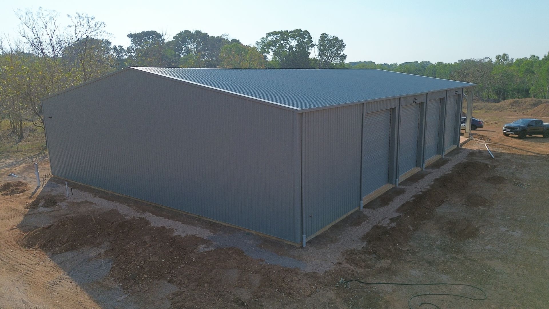 Large Metal Shed in a Rural Dirt Clearing — Tick of Approval Pty Ltd in Darwin, NT
