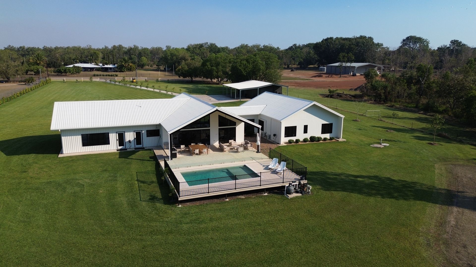 Aerial View of a White Farmhouse With a Swimming Pool — Tick of Approval Pty Ltd in Berrimah, NT