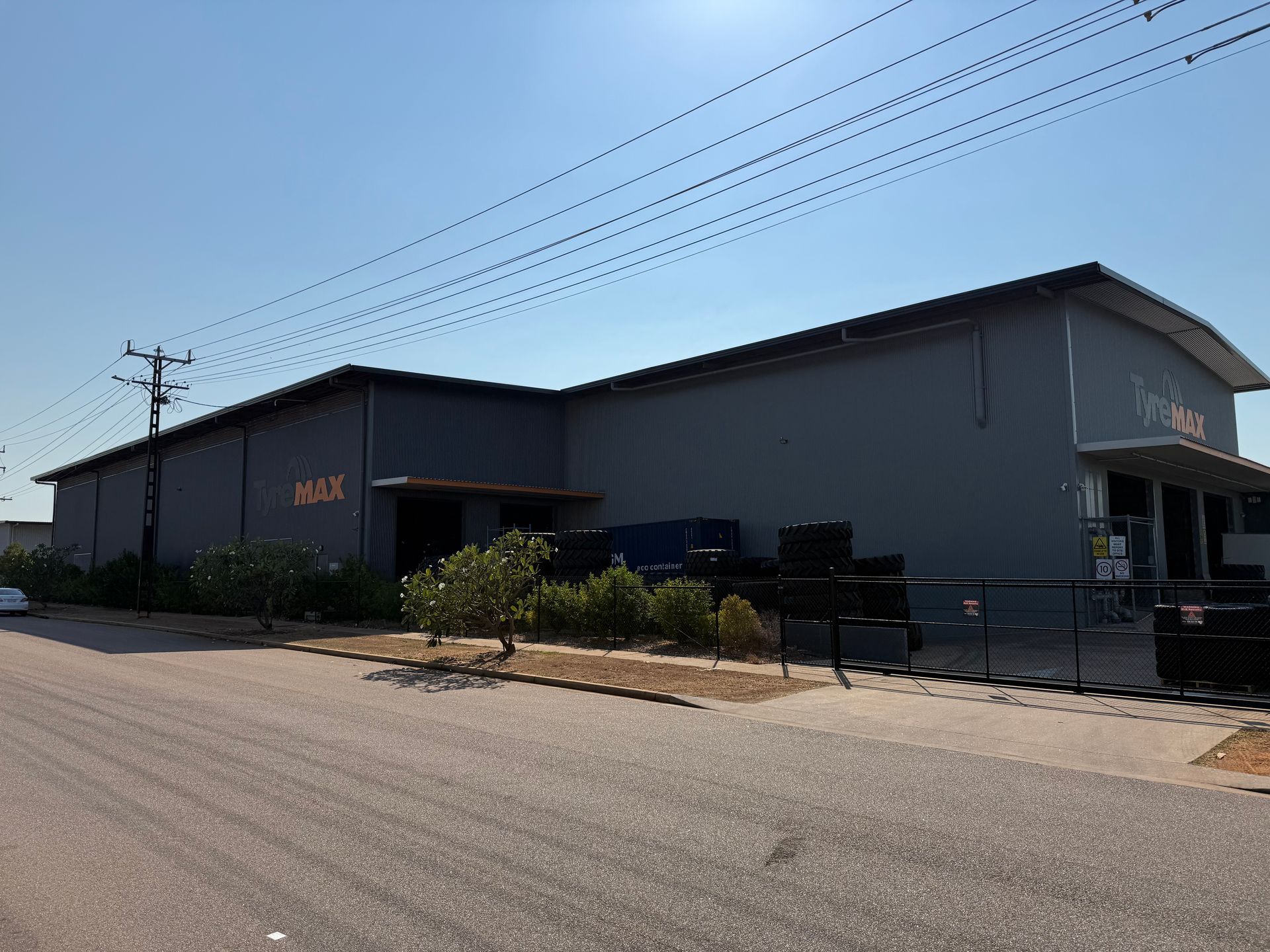Industrial Warehouse Buildings Beside a Gravel Road — Tick of Approval Pty Ltd in Berrimah, NT