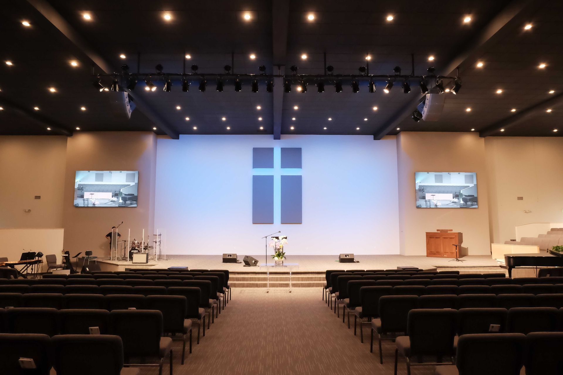 An empty church with a cross on the wall