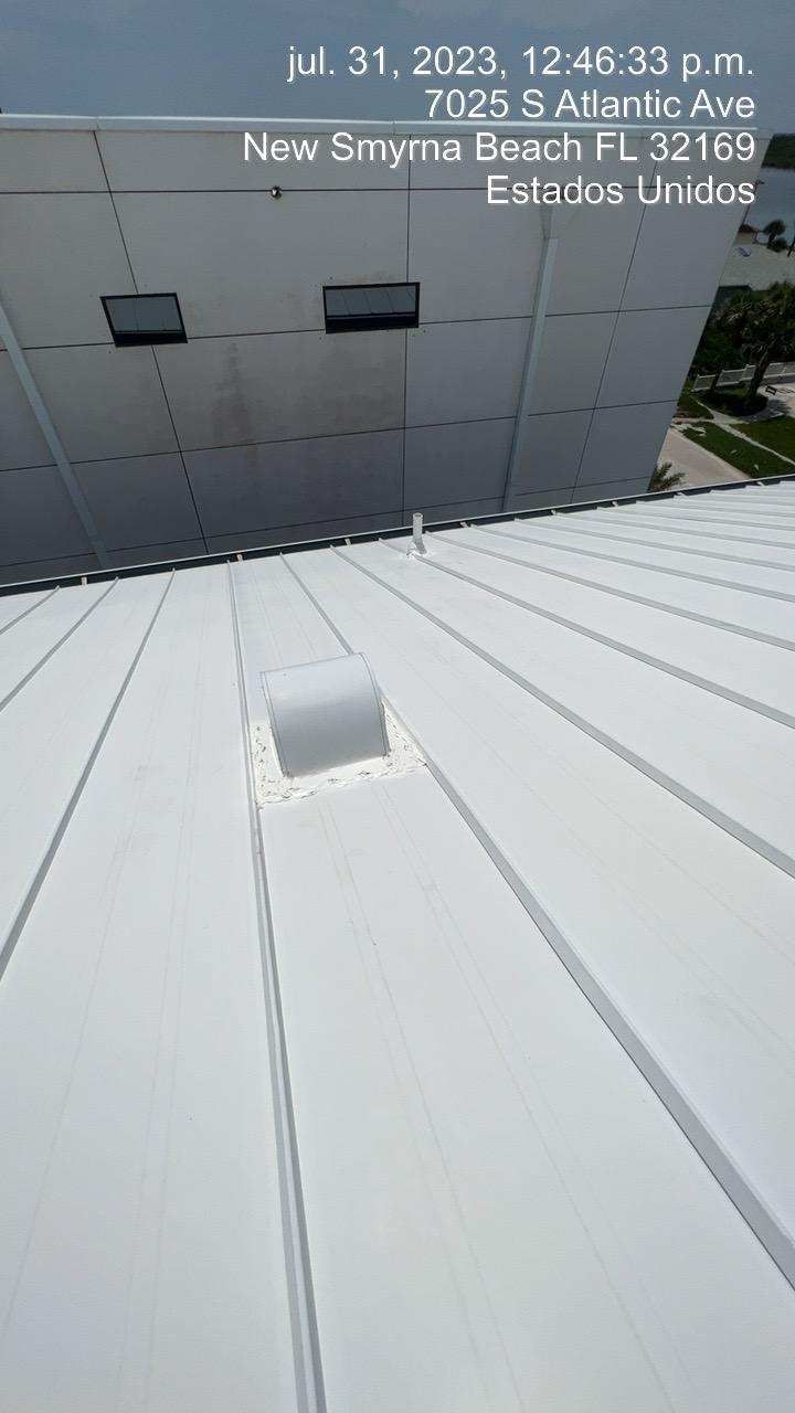 A bright white metal roof with vents, taken in New Smyrna Beach, FL, July 31, 2023.