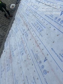 Roof underlayment being installed on a roof in Clermont, FL.