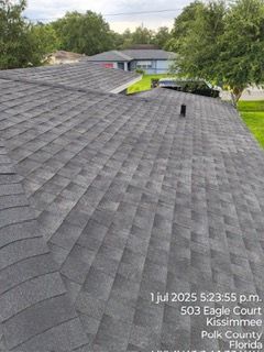Roof of a Kissimmee, Florida home with dark gray asphalt shingles. Date/time stamp: July 1, 2025, 5:23 p.m.