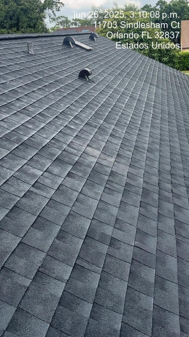 Dark gray shingle roof with vents.  Address and timestamp in top right corner.