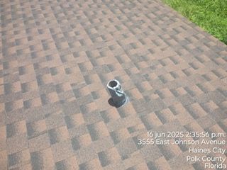 Roof with chimney and date stamp 16 Jun 2025 in Haines City, Florida.