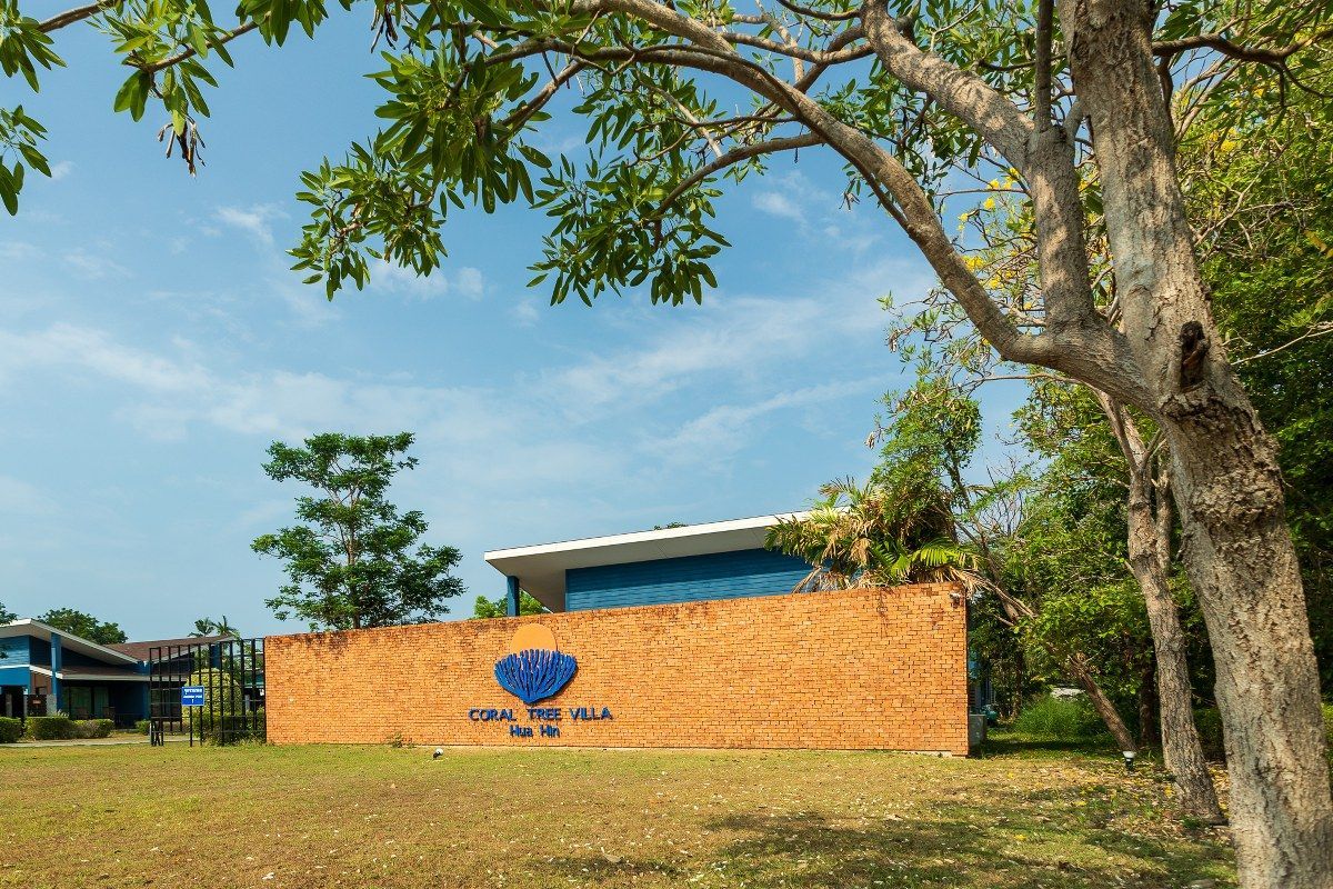 Blue and orange building with a sign that reads 