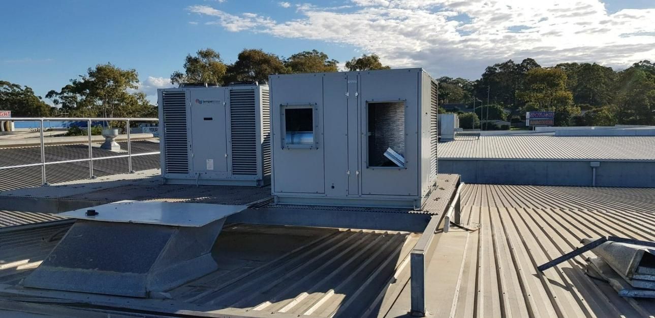 A Rooftop with A Few Air Conditioning Boxes — Gleeson's Air Conditioning in Port Macquarie, NSW