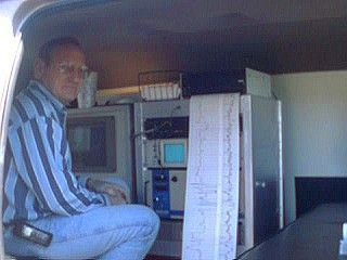 Man in a van monitors equipment