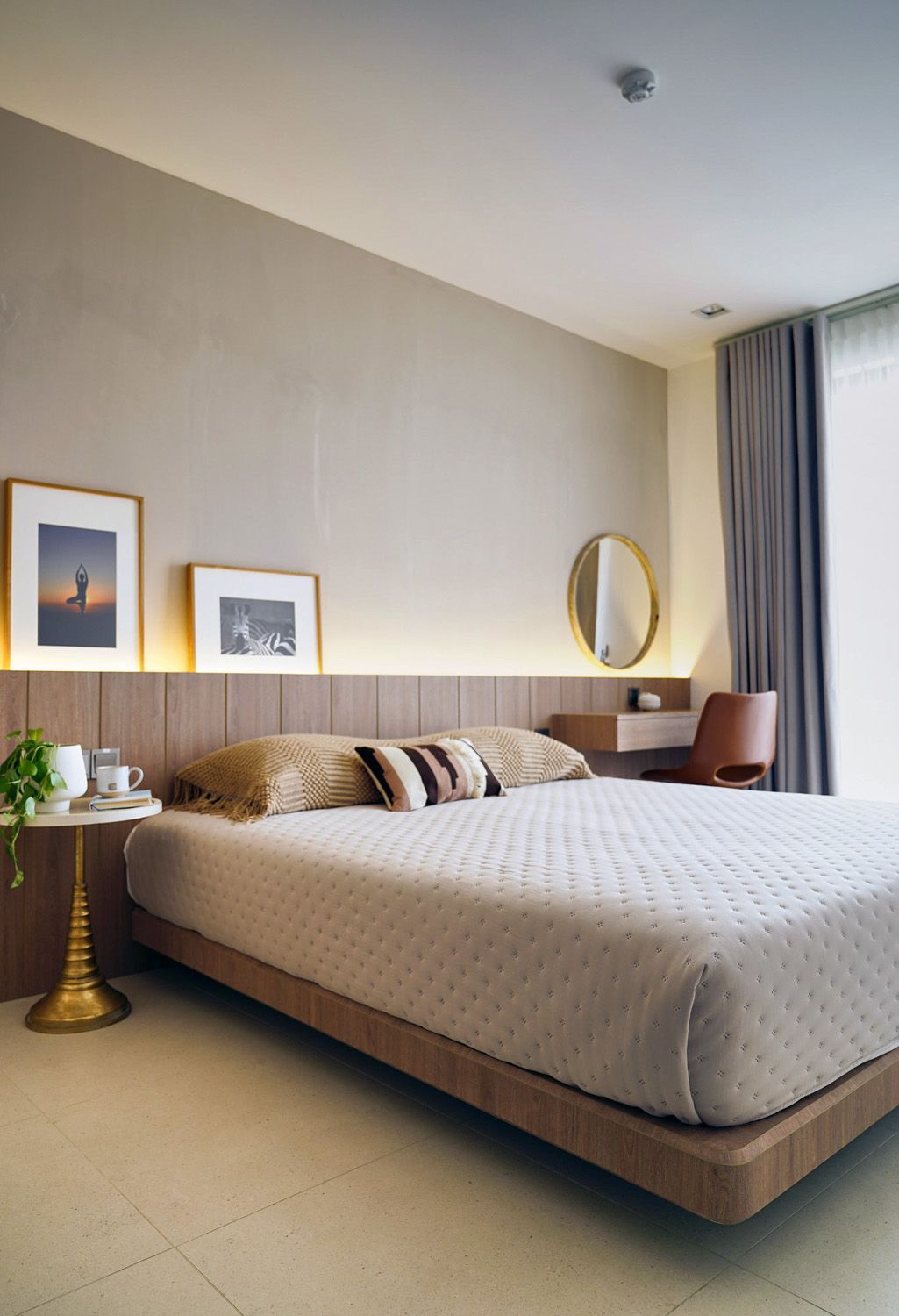 Bedroom with light wood built-ins, open shelving, and a bed with a woven headboard.
