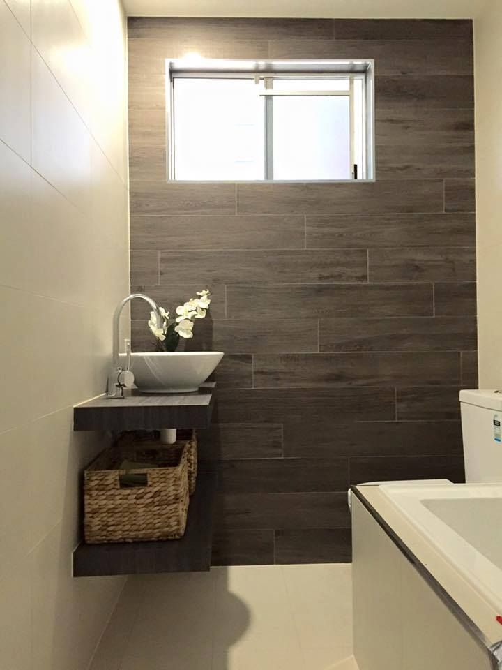A Bathroom With a Sink, Toilet and Window — NGK Constructions In Freshwater, QLD