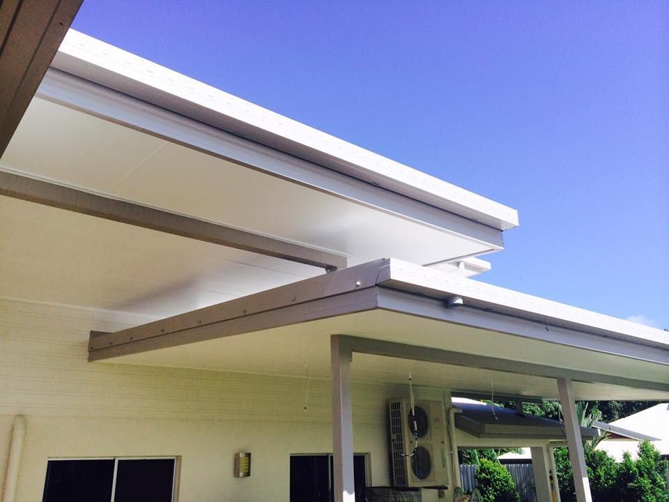 A White House With a White Roof and a Blue Sky in the Background — NGK Constructions In Freshwater, QLD