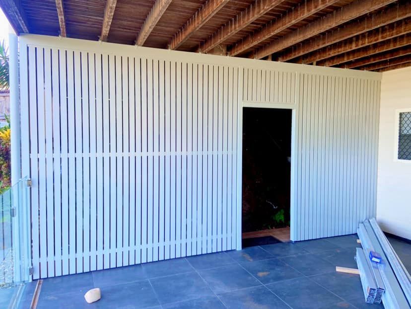 A White Fence With a Door in the Middle of It — NGK Constructions In Freshwater, QLD
