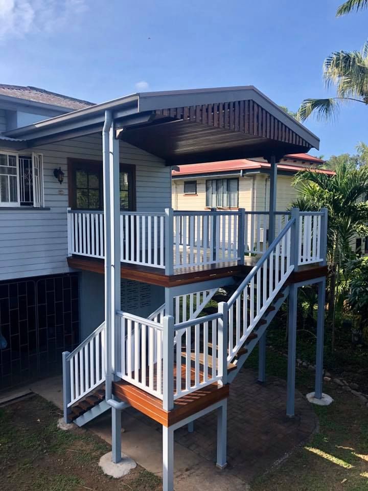 A House With a Balcony and Stairs on the Side of It — NGK Constructions In Freshwater, QLD