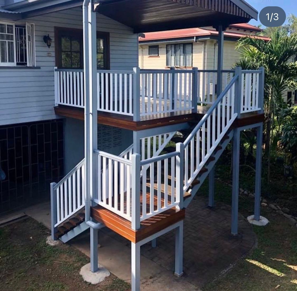 A Picture of a House With a Balcony and Stairs — NGK Constructions In Freshwater, QLD