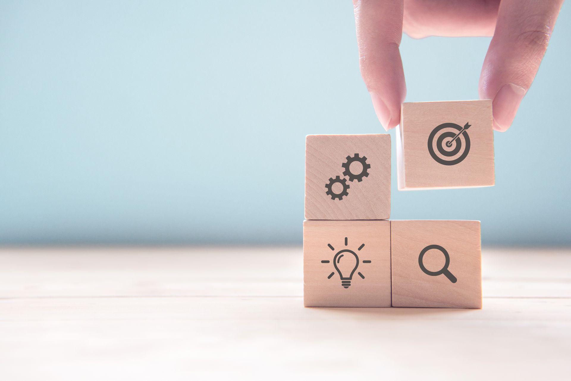 Building blocks labelled with strategy icons