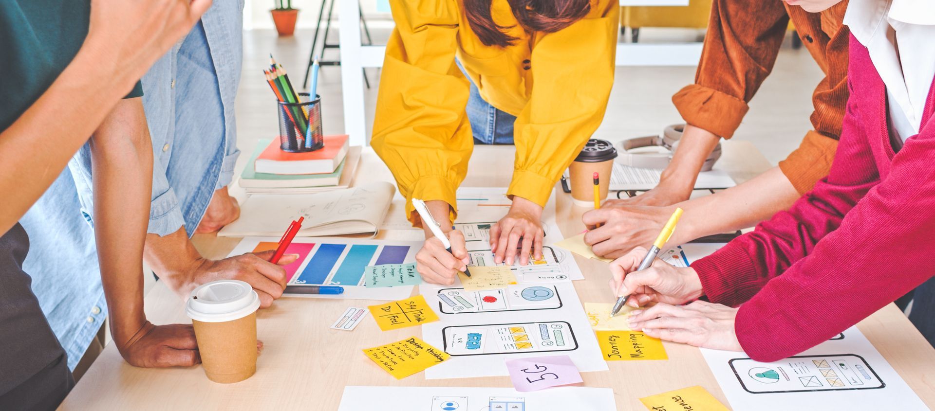Team working together on web and app design in an office