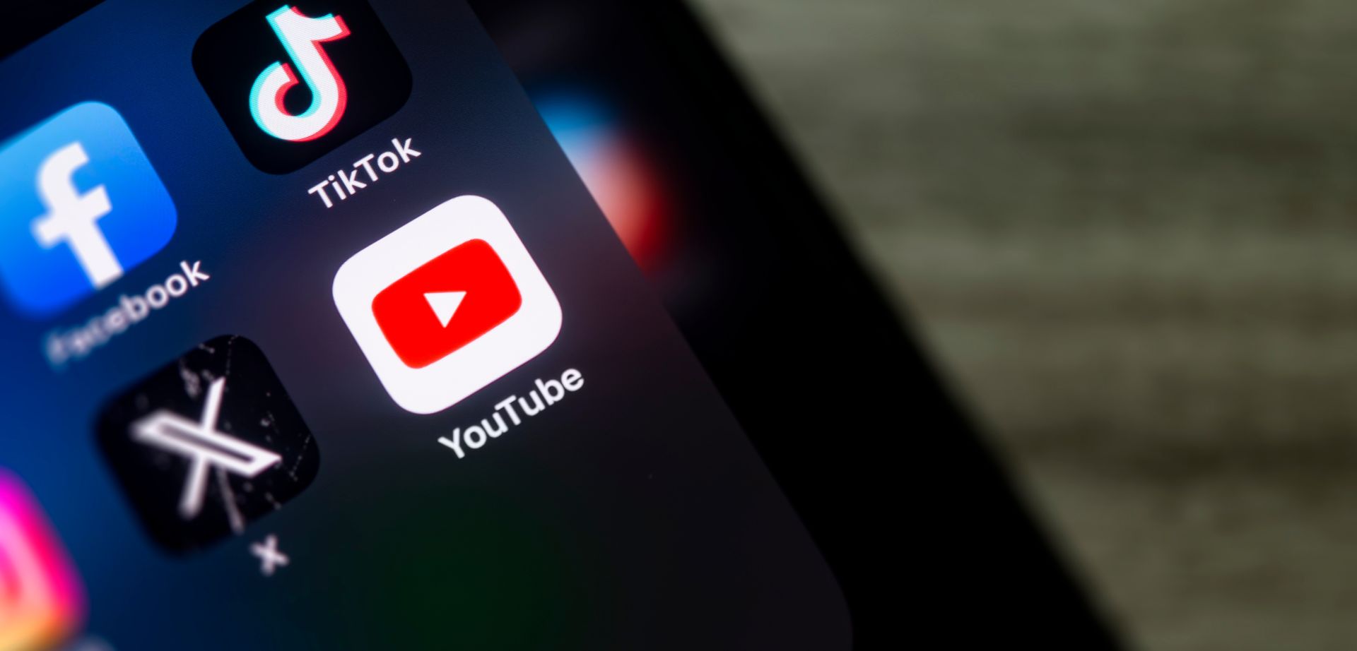 Phone screen showing social media apps including You Tube