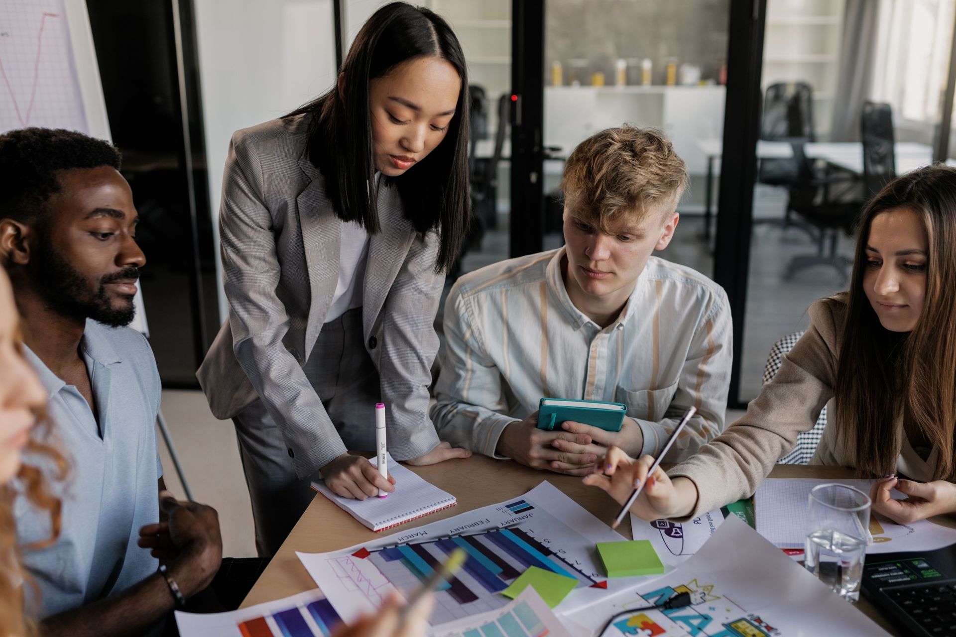 Team collaborating to select the best AI chatbot solution for business growth